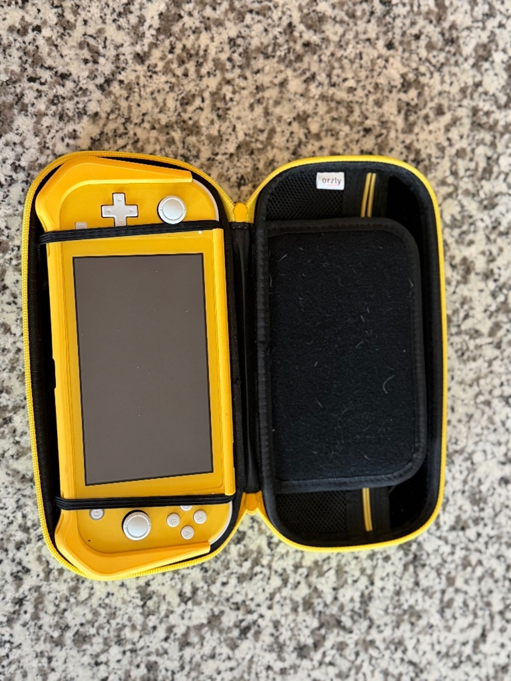 Nintendo Switch Lite Yellow Bundle w/ Orzly Case, Charger & Thumb Grips